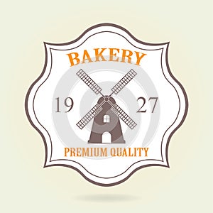 Bakery badge or label in old or vintage style. Bakery and bread design elements with windmill symbol isolated on white background.